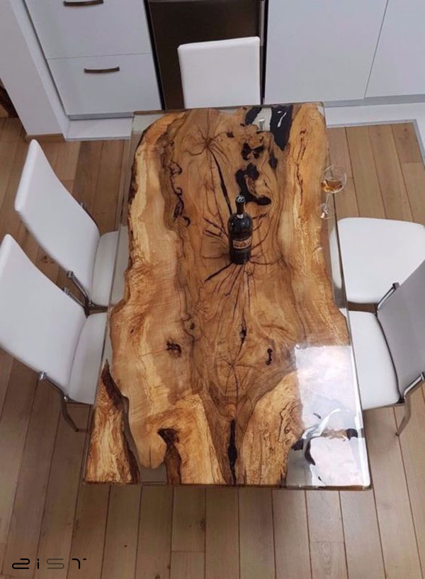 در این تصویر یک نمونه میز ناهار خوری چوب و رزین را مشاهده میکنید