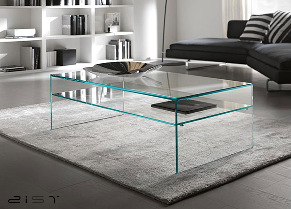 در این تصویر یک میز جلو مبلی شیشه ای مستطیلی را مشاهده میکنید